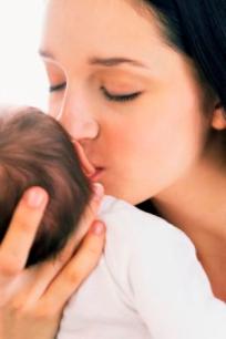 At the Proms, a mother holding her baby and singing a Lullaby